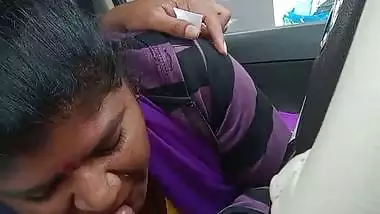 Telugu woman gives a desi blowjob to her man in a car